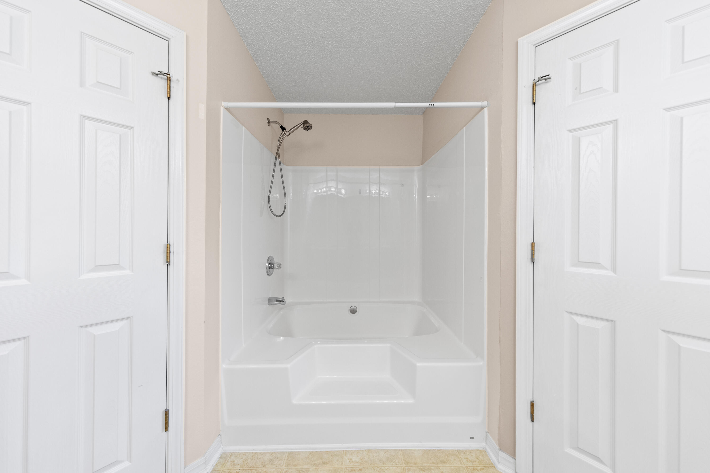 275 Limestone Circle Crestview, FL 32539 - Photo 36 of 45 a bathroom with a shower and a bath tub