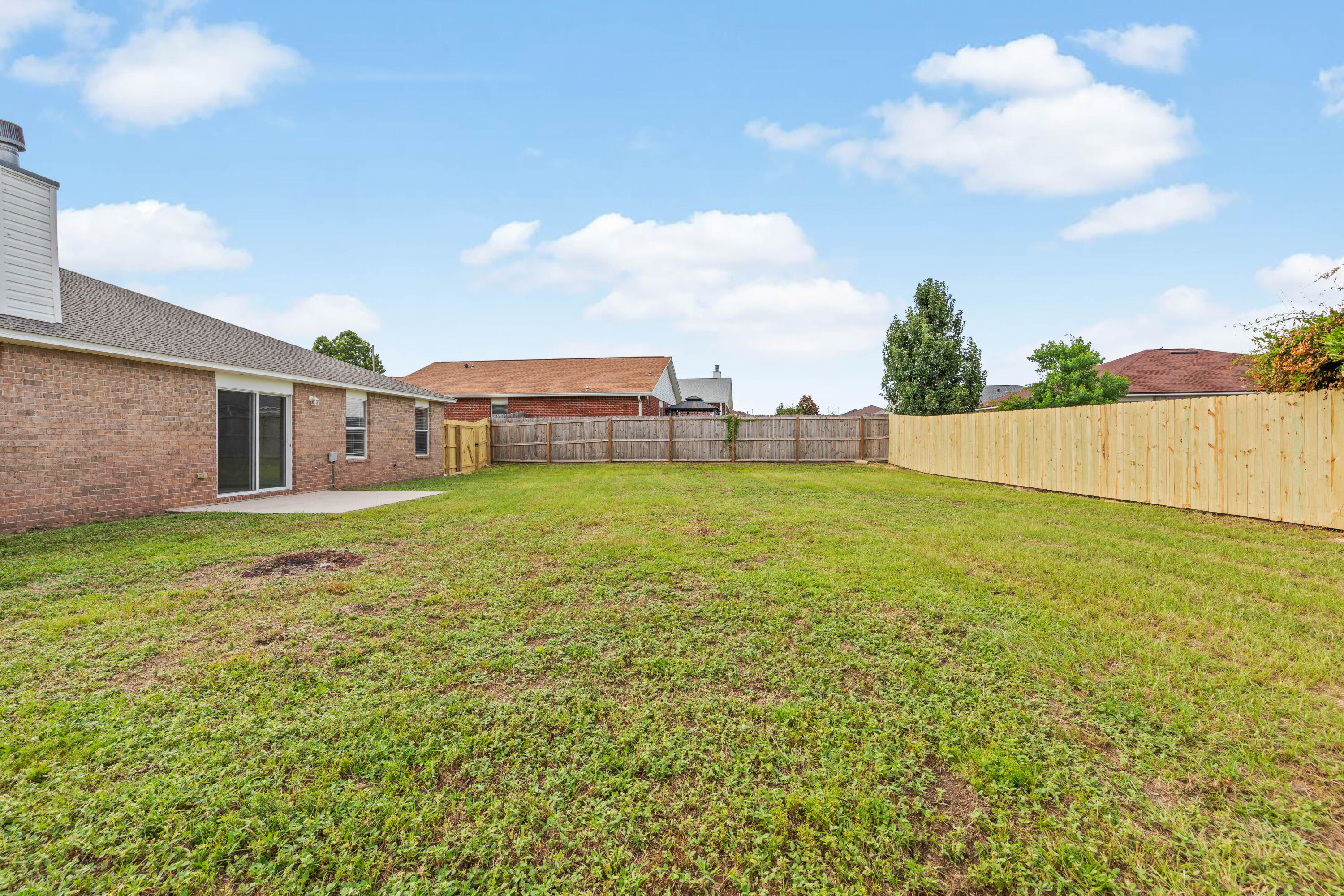 275 Limestone Circle Crestview, FL 32539 - Photo 42 of 45 a view of a house with a yard and sitting area