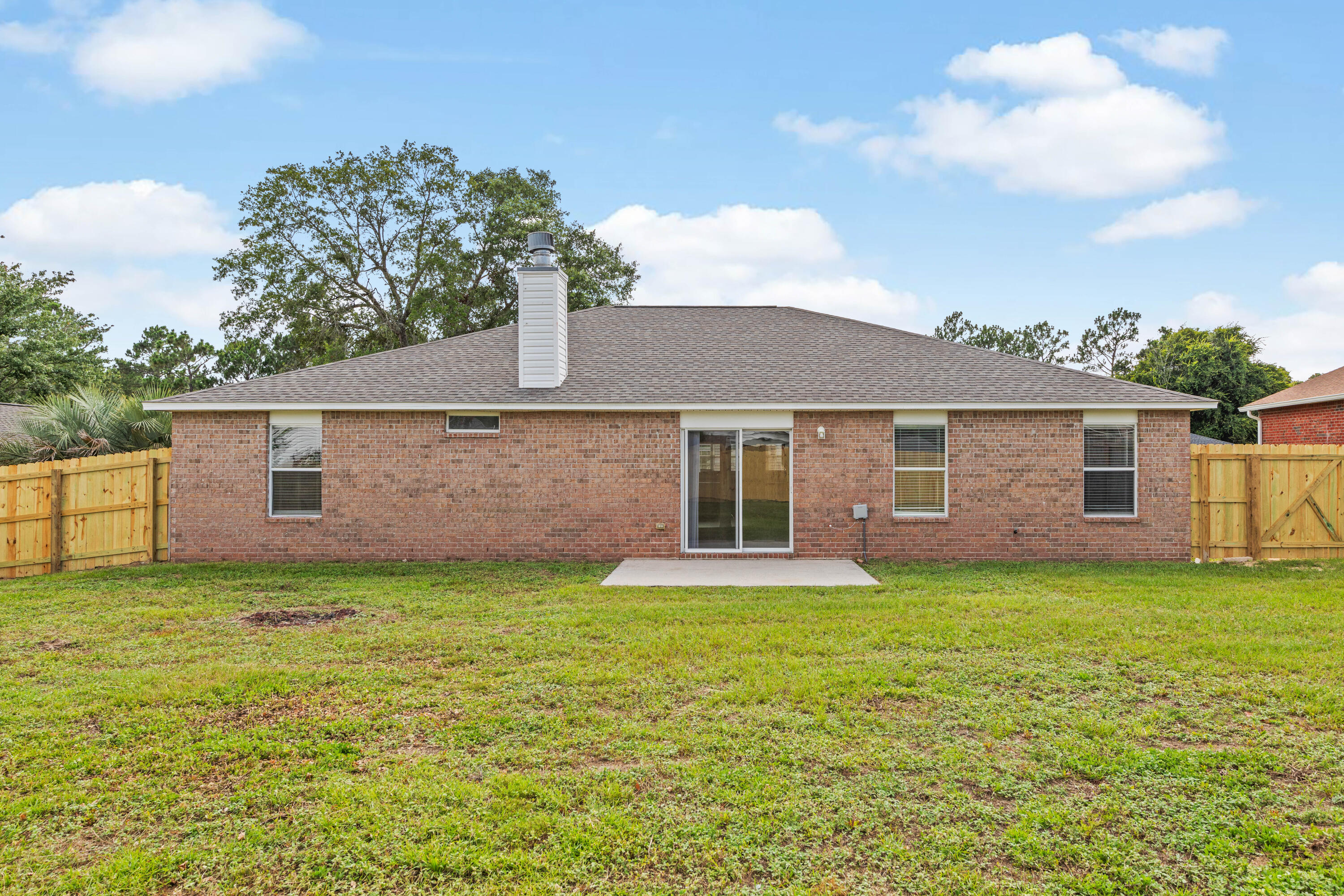 275 Limestone Circle Crestview, FL 32539 - Photo 44 of 45 a view of a yard in front of a house
