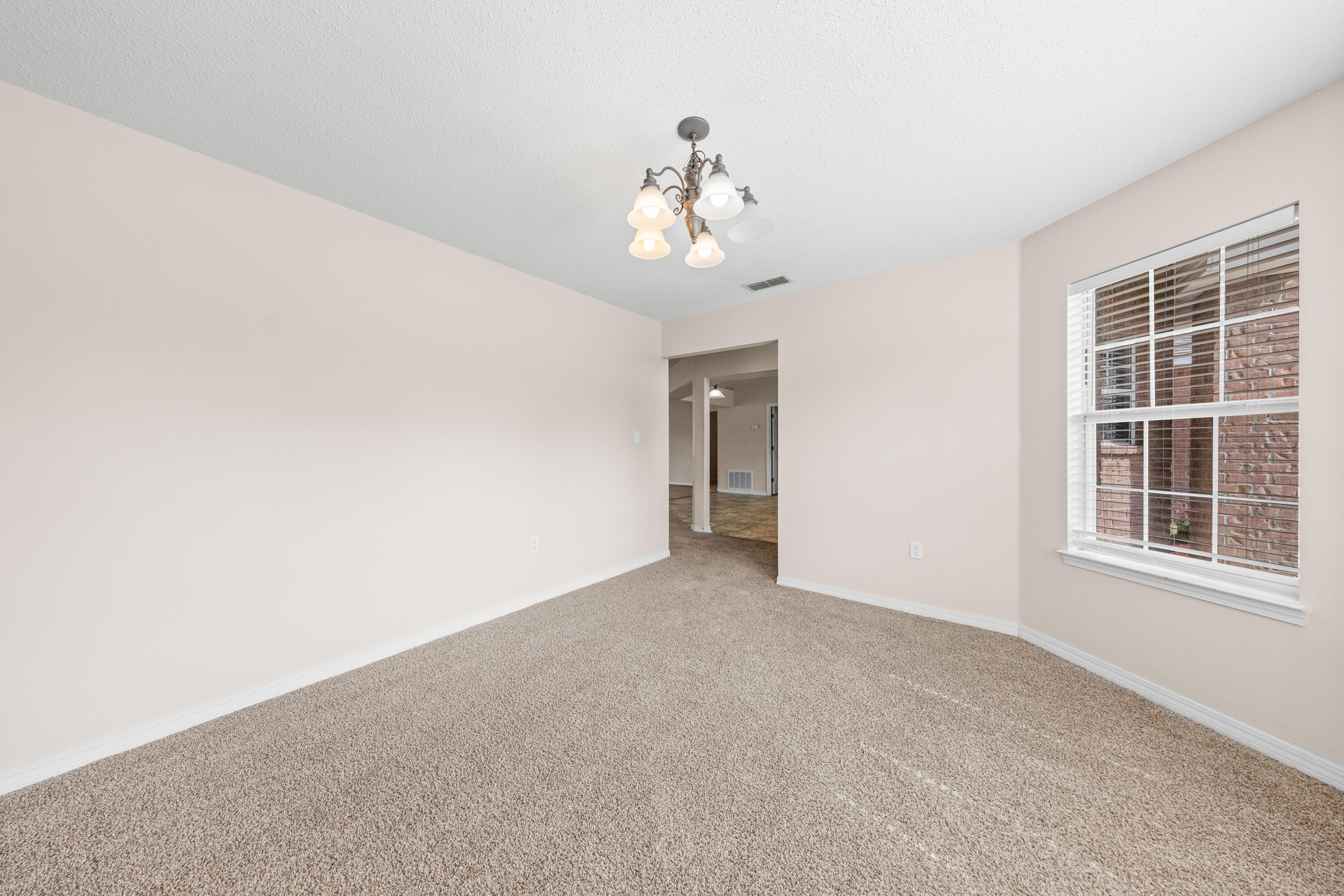 275 Limestone Circle Crestview, FL 32539 - Photo 7 of 45 a view of an empty room with a window