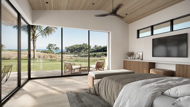 a bedroom with a large bed and a flat tv screen on dresser