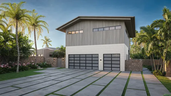 a front view of a house with a yard and potted plants