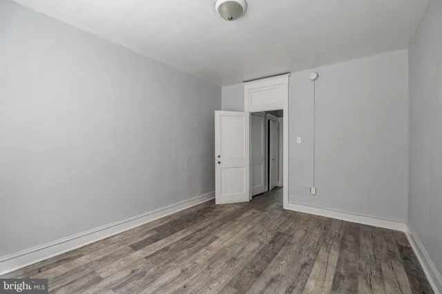 a white toilet sitting next to a bath tub
