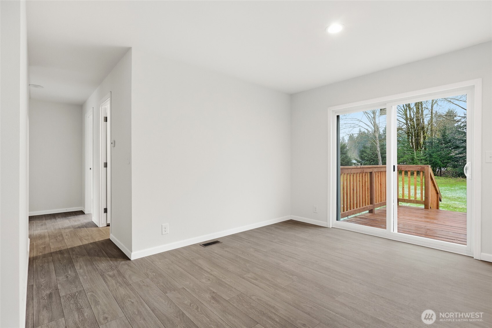 30 Porter Creek Road Elma, WA 98541 - Photo 13 of 33 an empty room with wooden floor and windows