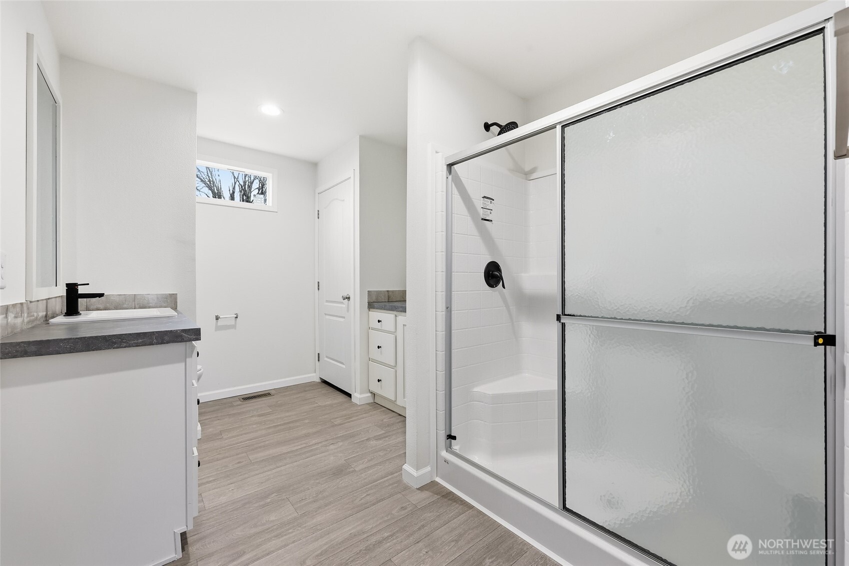 30 Porter Creek Road Elma, WA 98541 - Photo 19 of 33 a bathroom with a shower sink and mirror