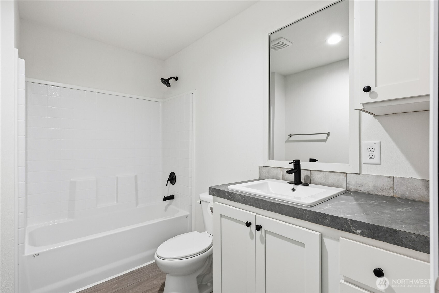 30 Porter Creek Road Elma, WA 98541 - Photo 23 of 33 a bathroom with a granite countertop sink a toilet and shower
