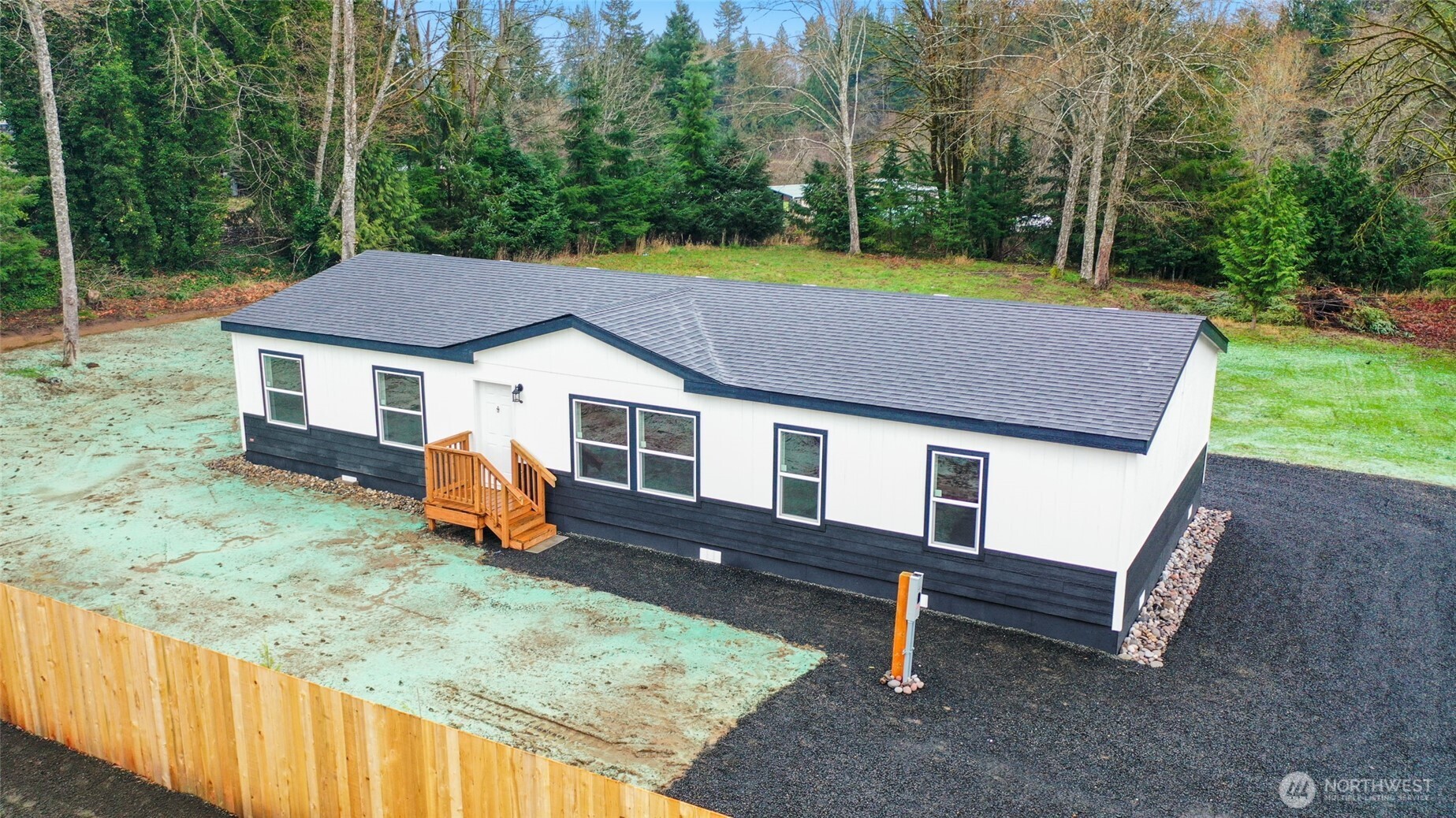 30 Porter Creek Road Elma, WA 98541 - Photo 3 of 33 a house that has sitting area and garden