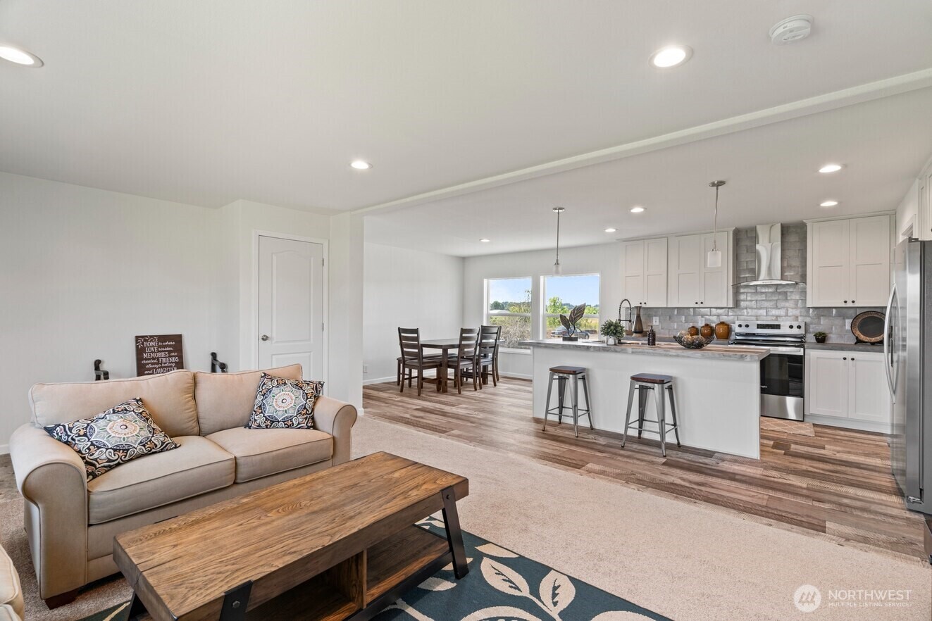 30 Porter Creek Road Elma, WA 98541 - Photo 9 of 12 a living room with stainless steel appliances kitchen island granite countertop furniture and kitchen view