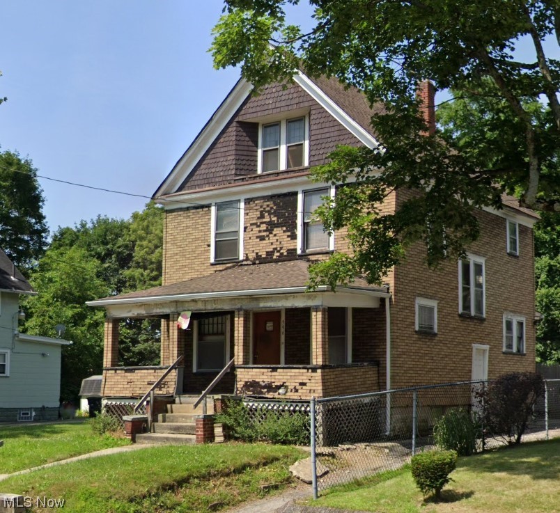 596 Rhodes Avenue Akron, OH 44307 - Photo 2 of 17 View of front facade with a front lawn and a porch
