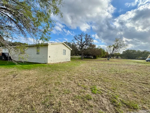 a view of a backyard of the house