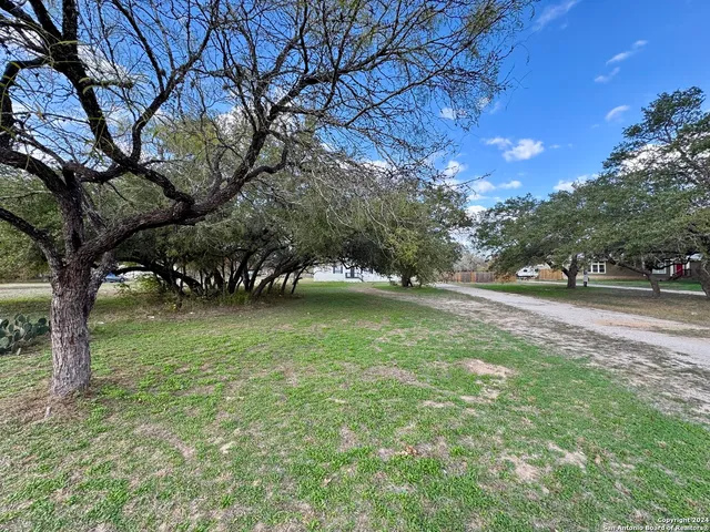 a view of outdoor space with deck and yard