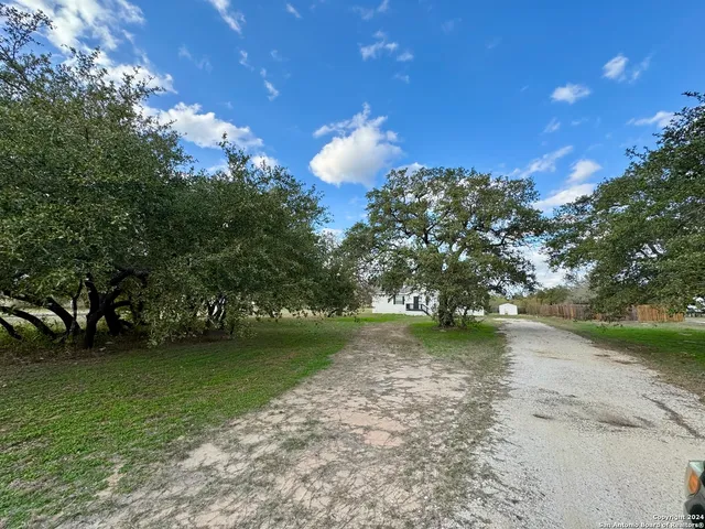 a view of a golf course with a yard