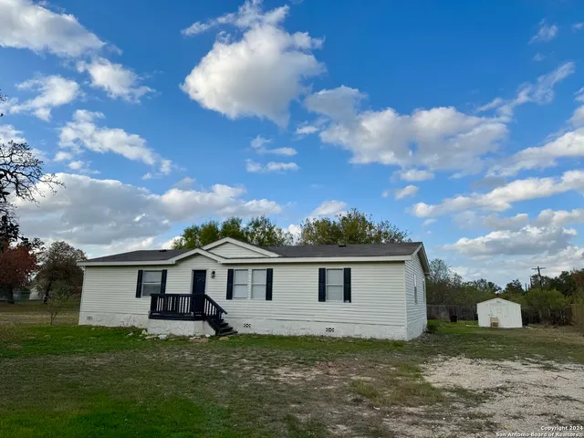 a view of a house with a big yard
