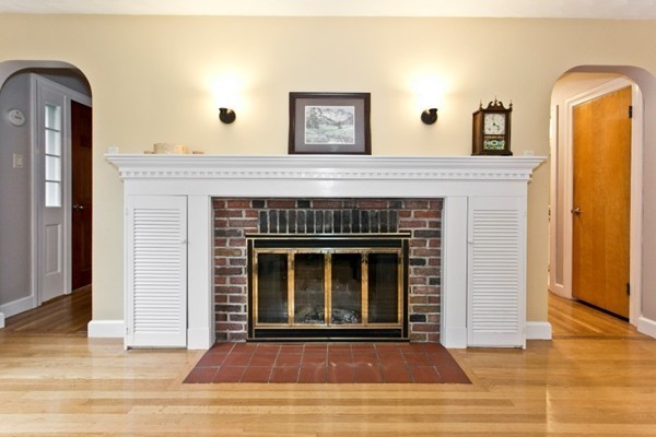 20 Spring Street Wakefield, MA 01880 - Photo 12 of 30 a view of a livingroom with wooden floor and a fireplace