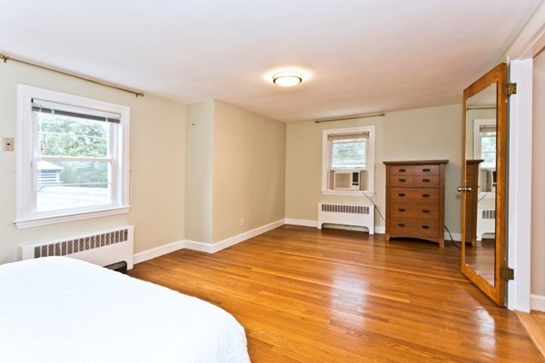20 Spring Street Wakefield, MA 01880 - Photo 17 of 30 a bedroom with a bed and a window