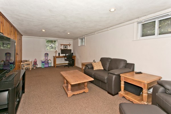 20 Spring Street Wakefield, MA 01880 - Photo 23 of 30 a living room with furniture and a flat screen tv