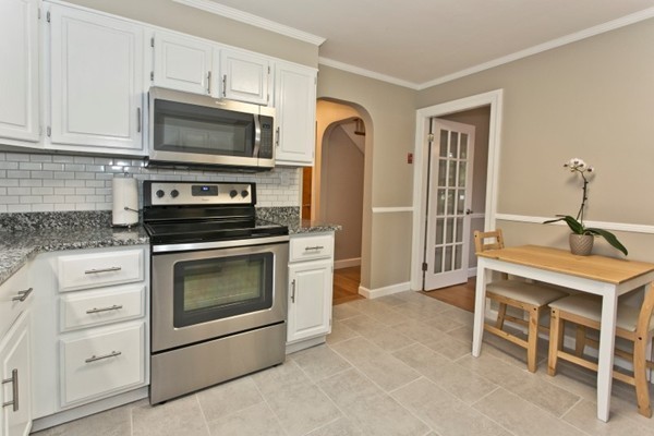 20 Spring Street Wakefield, MA 01880 - Photo 7 of 30 a kitchen with a stove oven and a microwave
