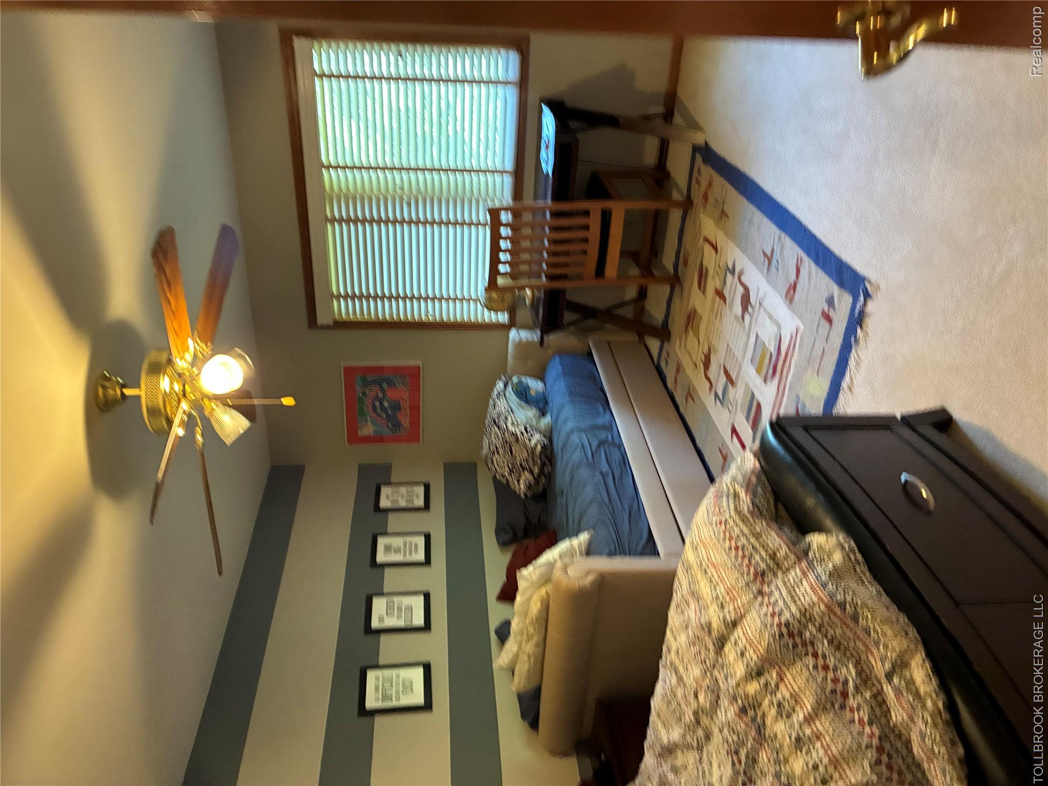 6187 Country Ridge Drive Troy, MI 48098 - Photo 16 of 23 Ceiling fan with integrated lighting, natural wood-finish window blinds, and carpeted flooring