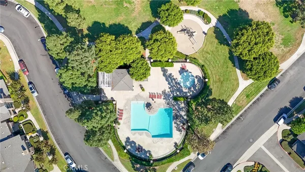 an aerial view of a house with a yard and garden