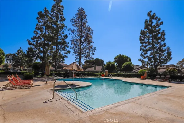 swimming pool view with a outdoor seating