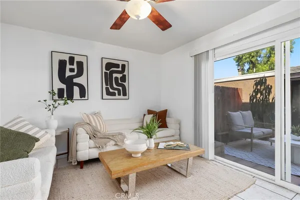 a living room with furniture and a window
