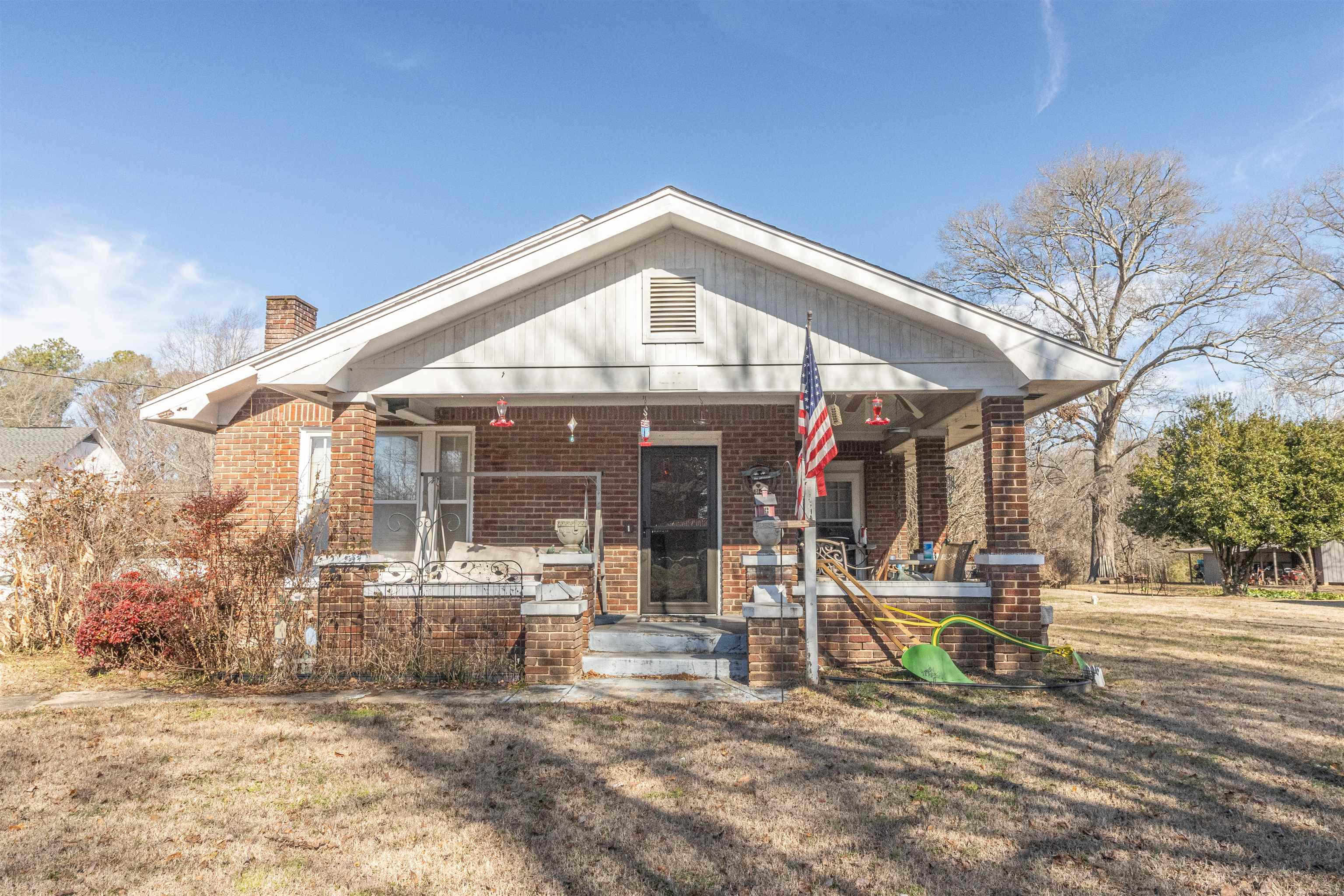 11945 Peavine Road Pocahontas, TN 38061 - Photo 1 of 23 a view of a house with sitting area and garden
