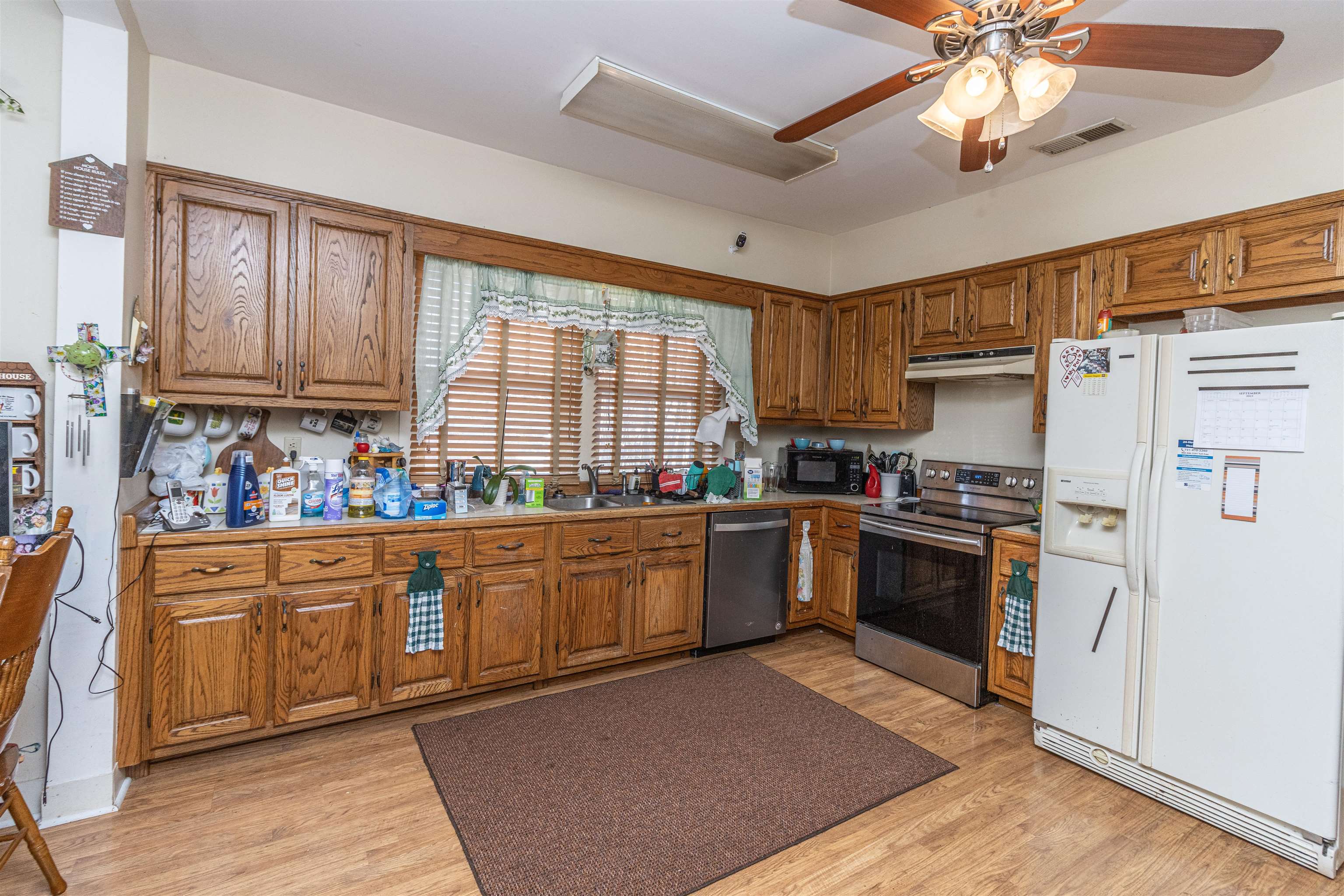 11945 Peavine Road Pocahontas, TN 38061 - Photo 14 of 23 a kitchen with granite countertop a refrigerator stove top oven and sink