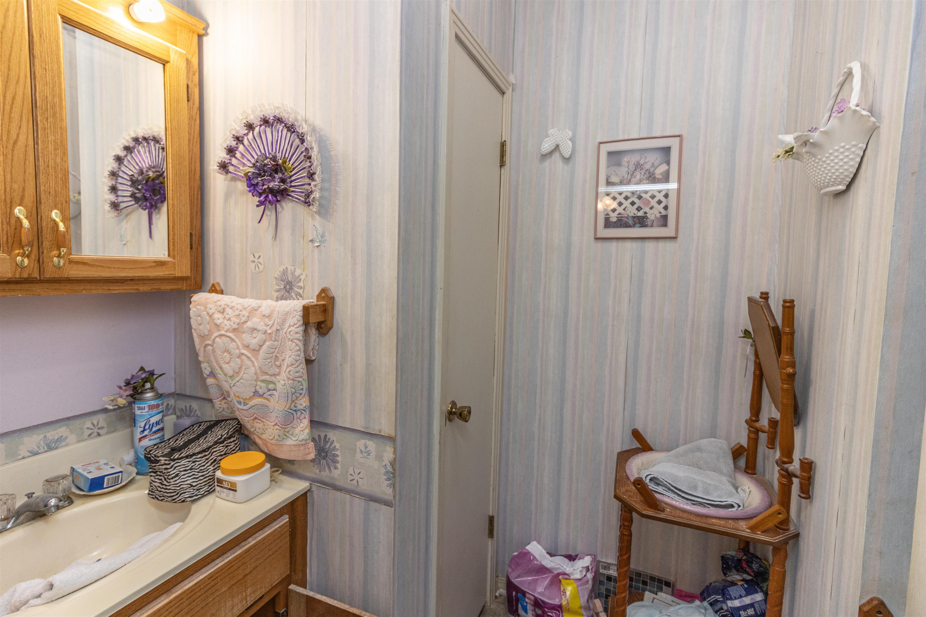 11945 Peavine Road Pocahontas, TN 38061 - Photo 17 of 23 a bathroom with a sink toilet and mirror
