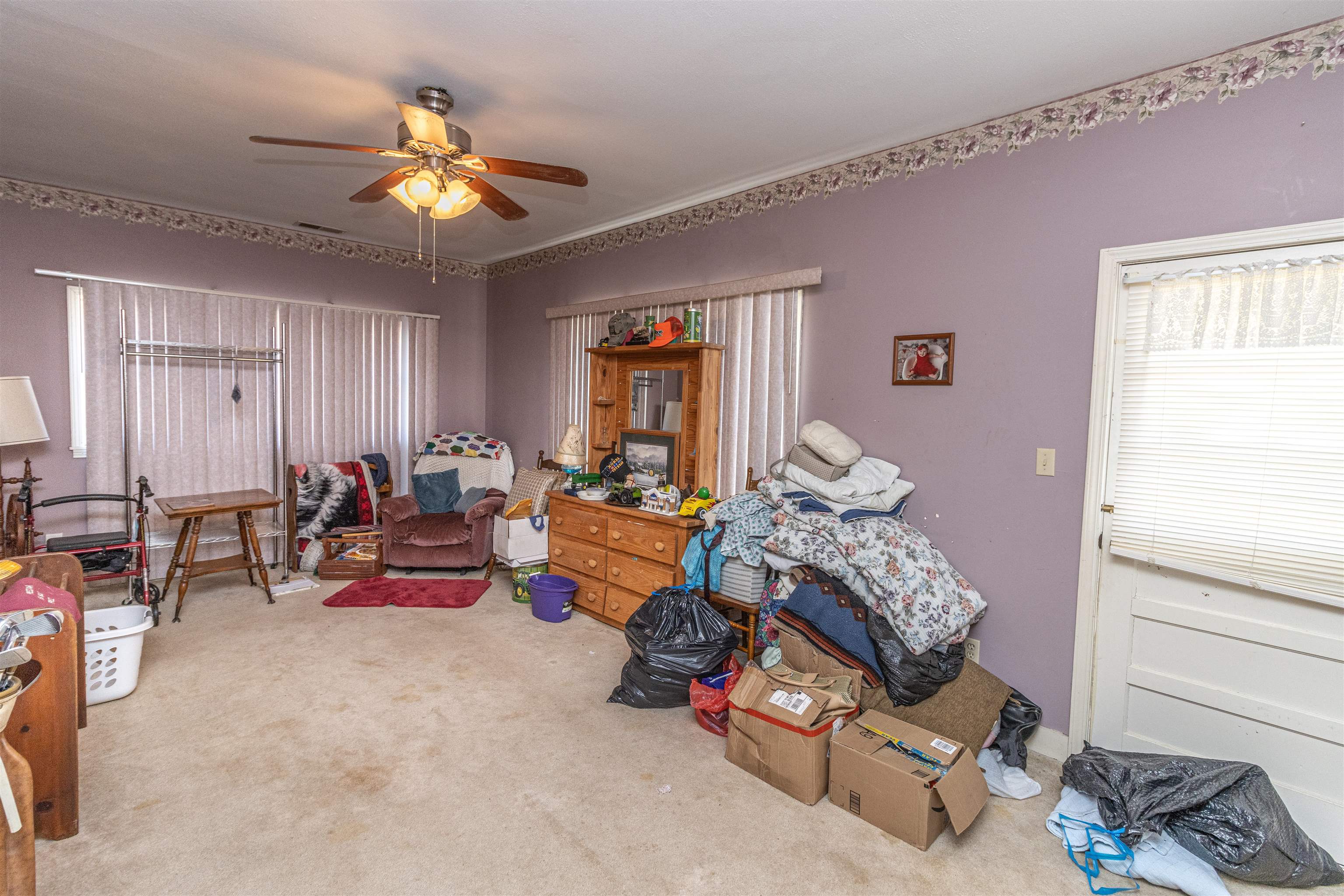 11945 Peavine Road Pocahontas, TN 38061 - Photo 23 of 23 a living room with furniture and a chandelier