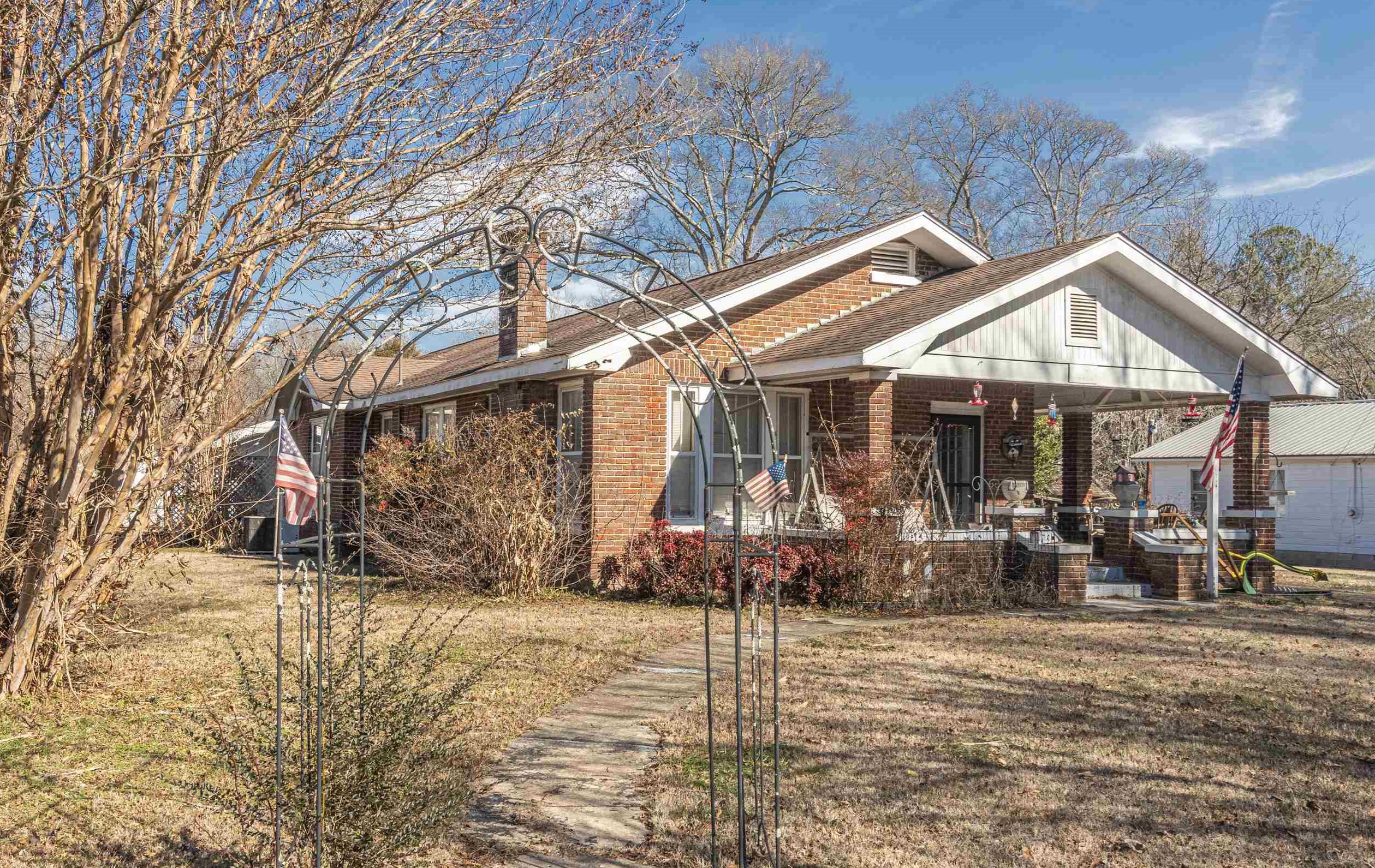 11945 Peavine Road Pocahontas, TN 38061 - Photo 3 of 23 a front view of a house with garden