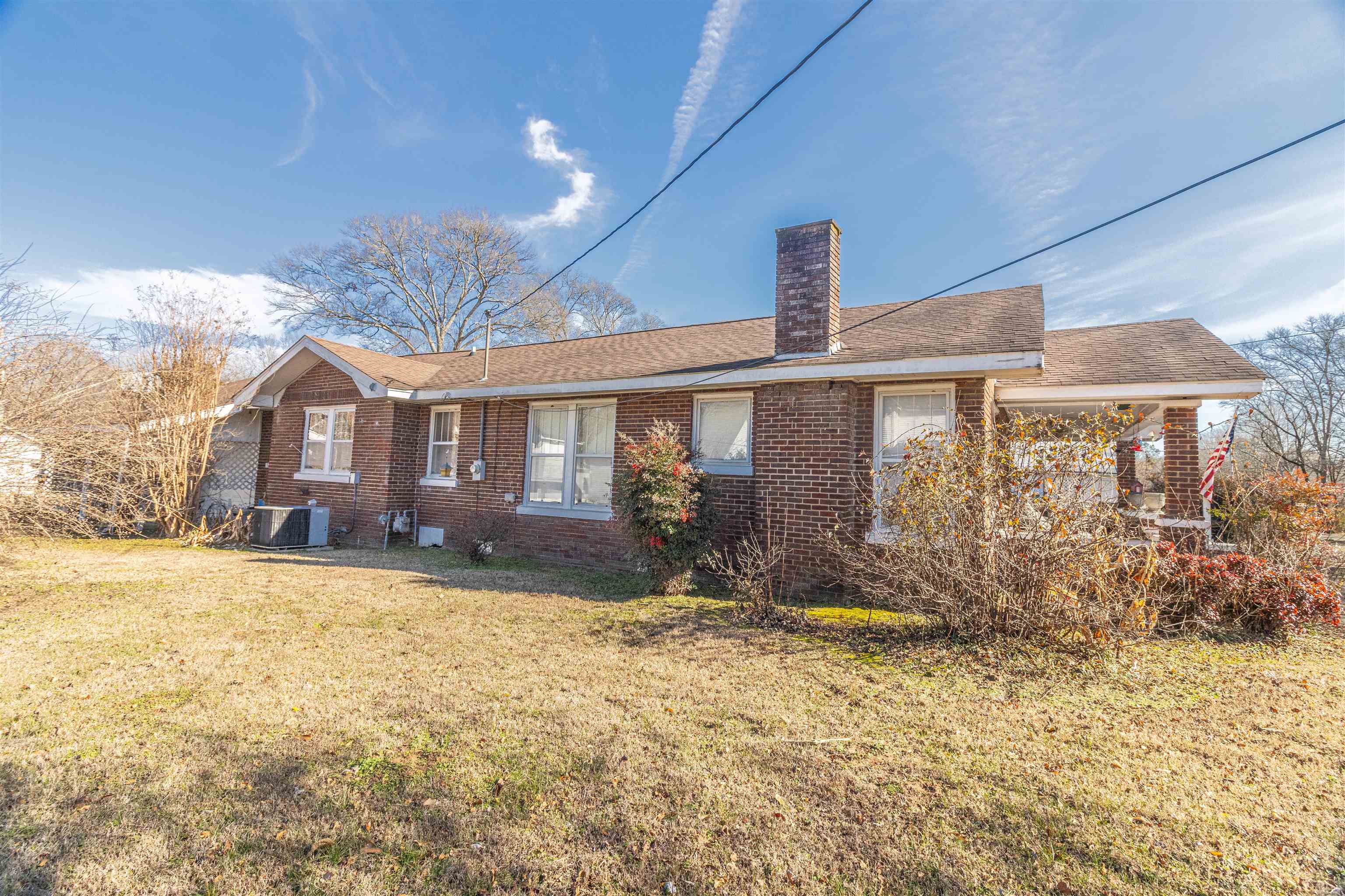 11945 Peavine Road Pocahontas, TN 38061 - Photo 4 of 23 a front view of a house with garden