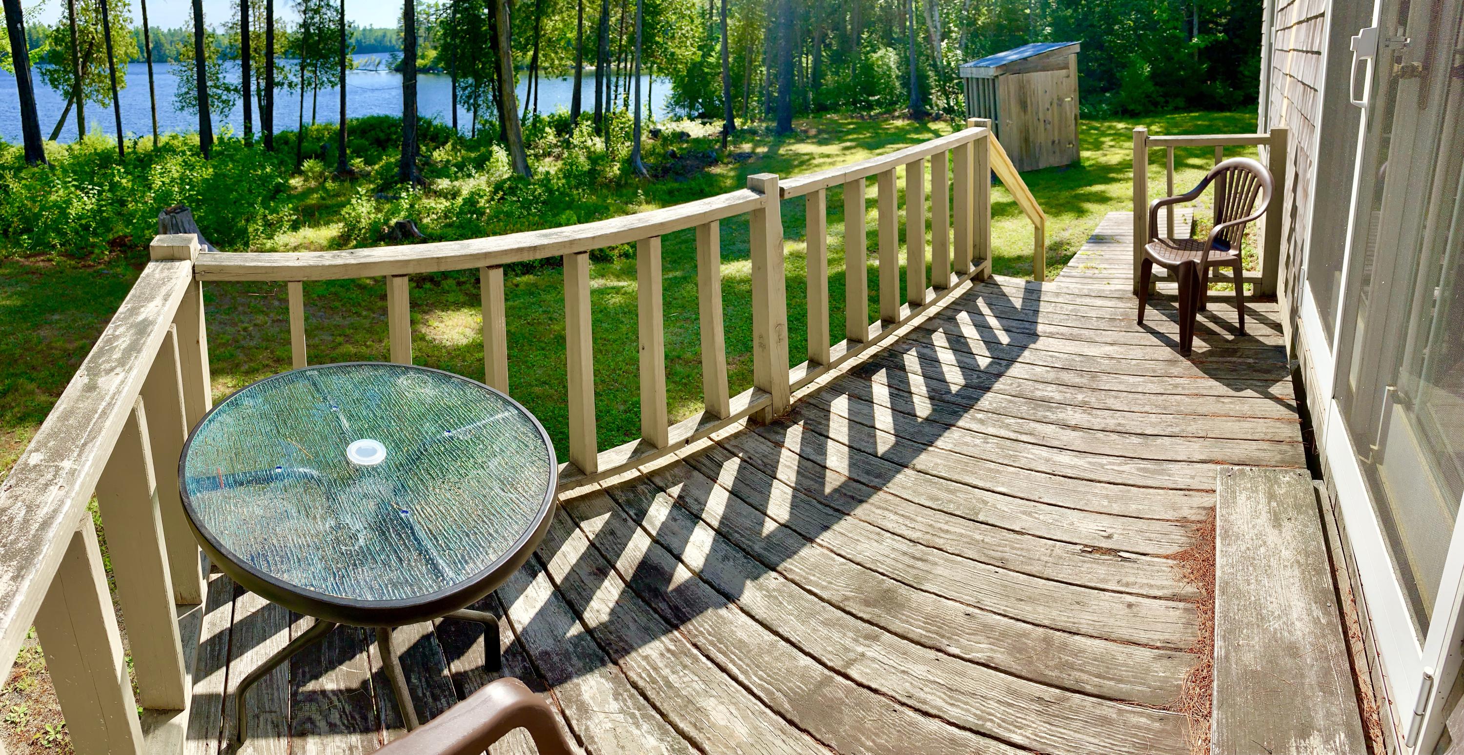 277 Shore Rd Lake View North Milo, ME 04463 - Photo 14 of 59 Deck Seating Overlooking the Lake