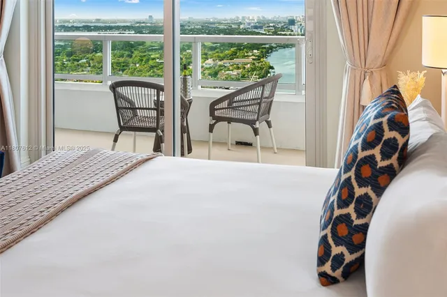 a bedroom with bed and a couch