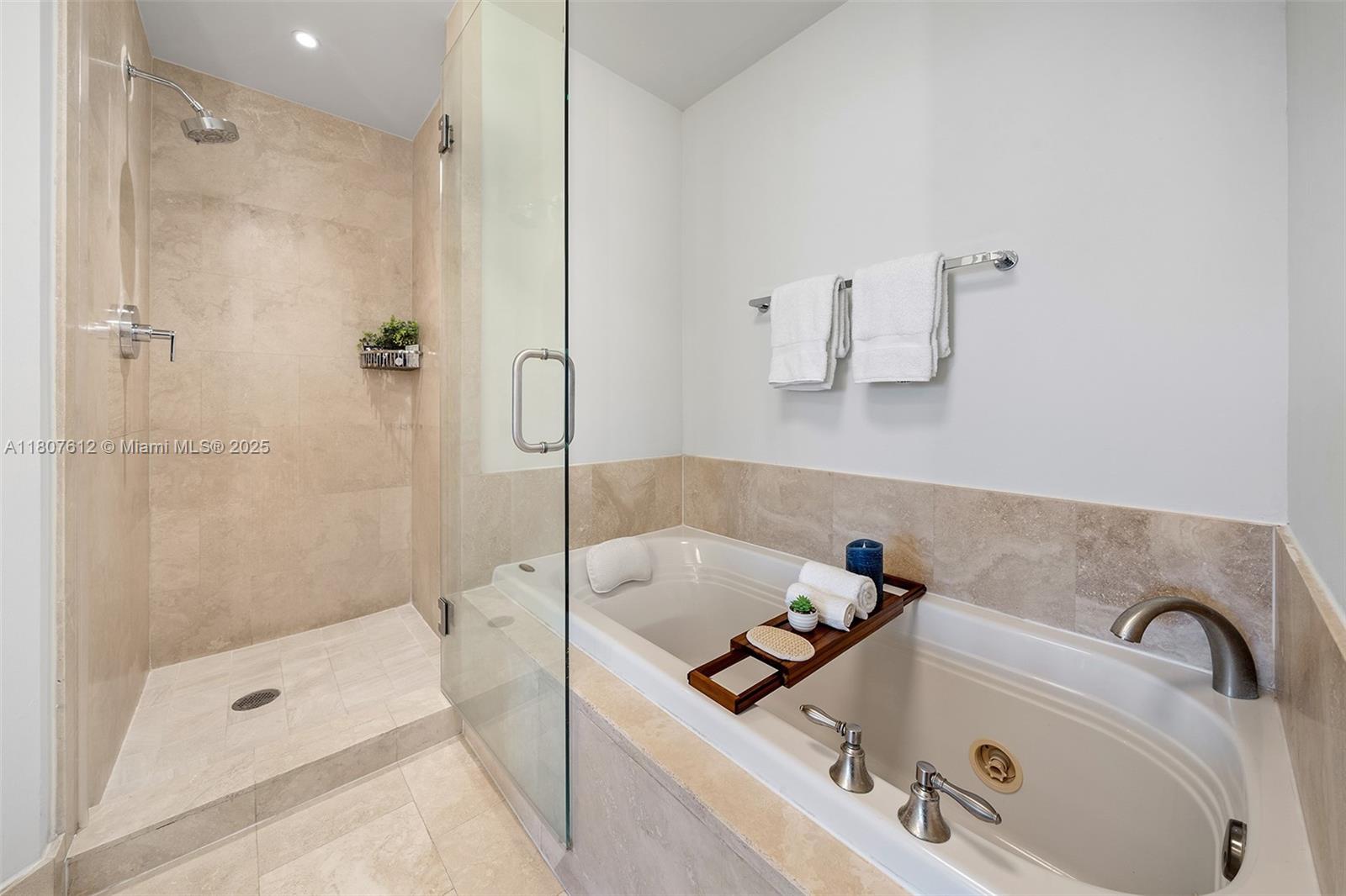 4401 Collins Avenue, Unit 3505 Miami Beach, FL 33140 - Photo 19 of 27 a bathroom with a tub sink and mirror