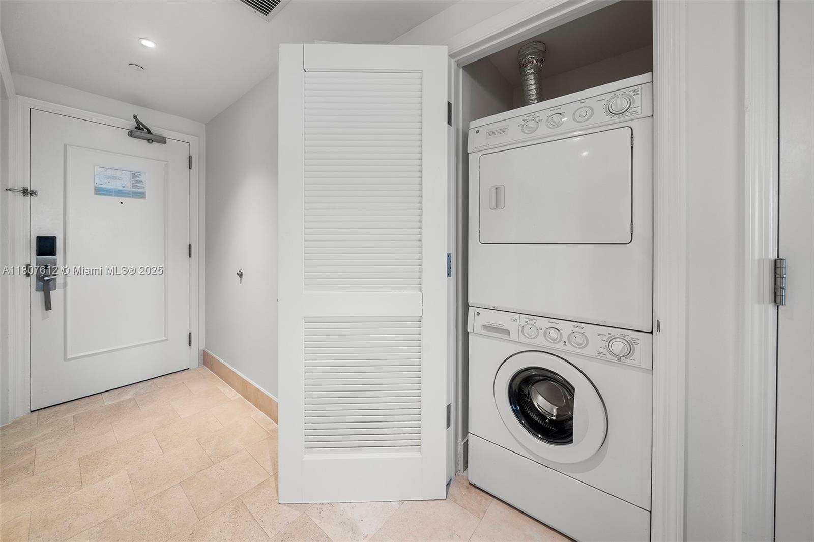 4401 Collins Avenue, Unit 3505 Miami Beach, FL 33140 - Photo 21 of 27 a view of a storage & utility room with washer and dryer