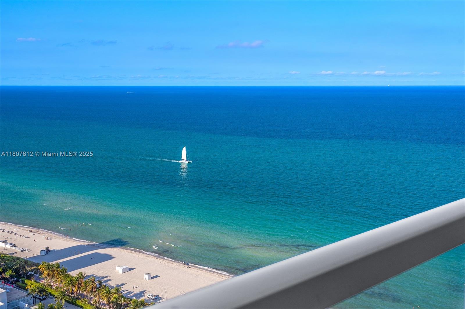 4401 Collins Avenue, Unit 3505 Miami Beach, FL 33140 - Photo 25 of 27 a view of an ocean and a yard