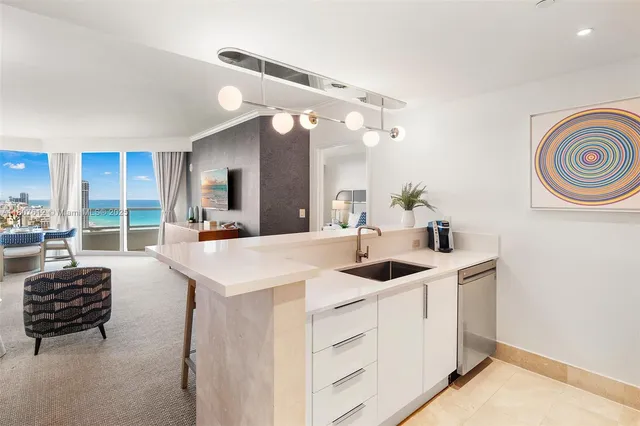 a kitchen with a table and chairs in it