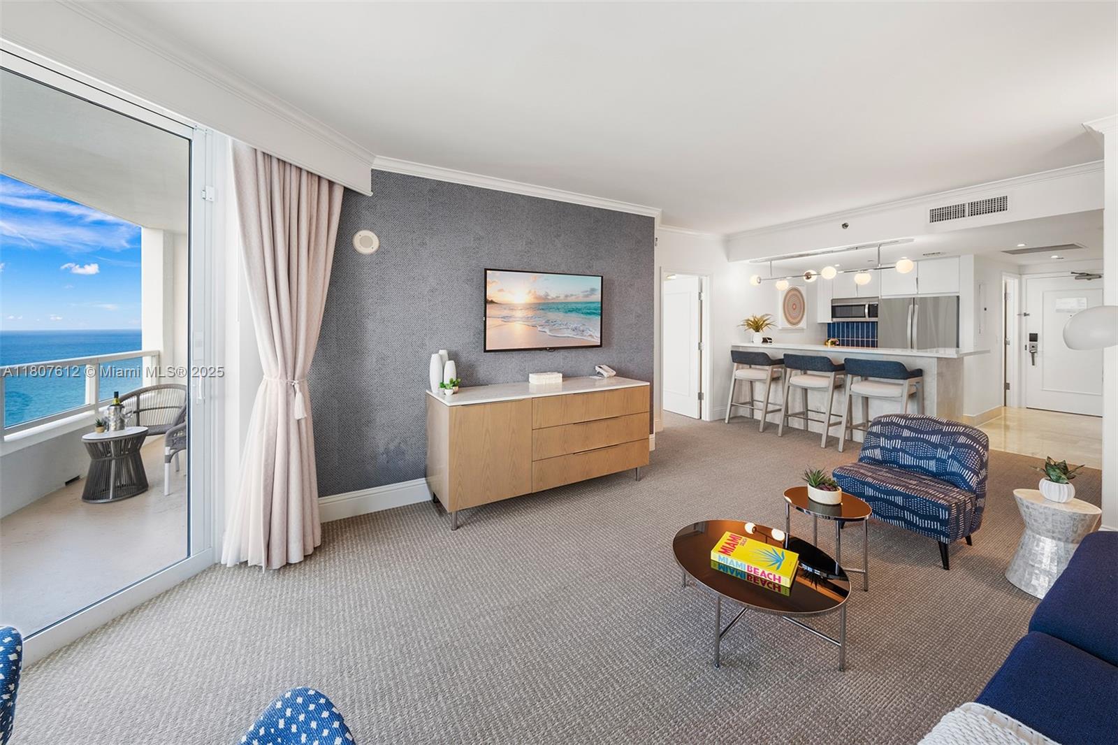 4401 Collins Avenue, Unit 3505 Miami Beach, FL 33140 - Photo 10 of 27 a living room with furniture and a wooden floor