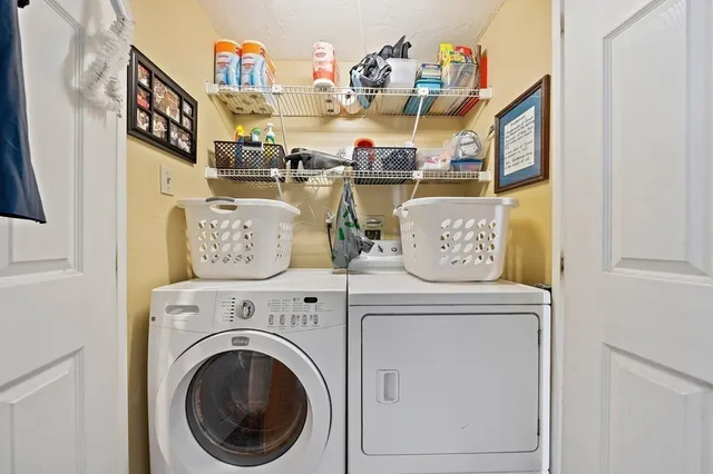 a view of living room with washer and dryer