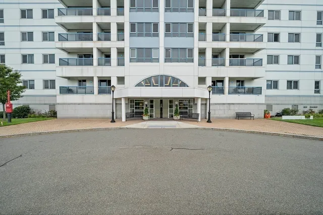a front view of a building with a street