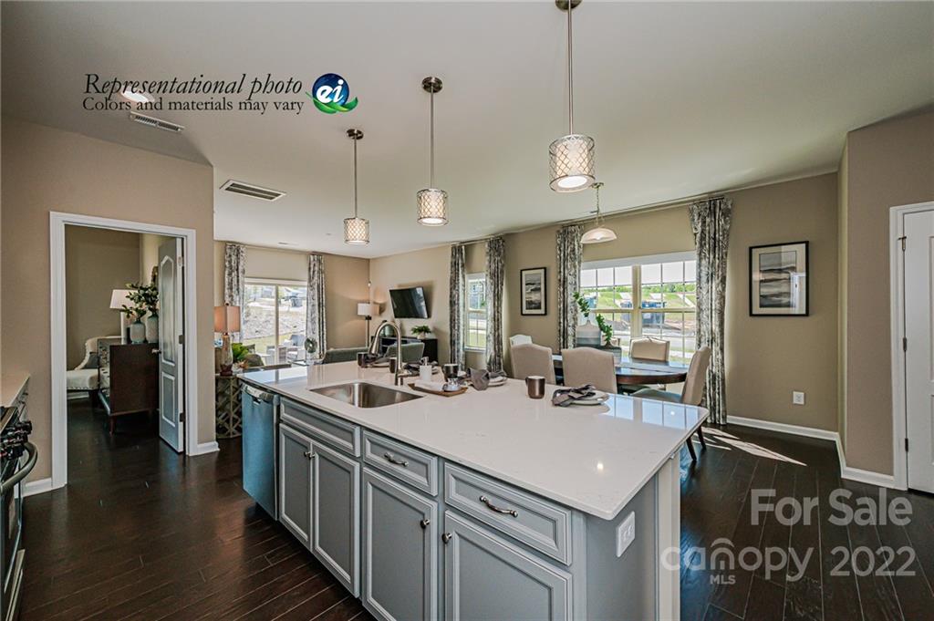 5777 Soft Shell Drive, Unit 309 Lancaster, SC 29720 - Photo 8 of 21 a kitchen with a stove sink and refrigerator