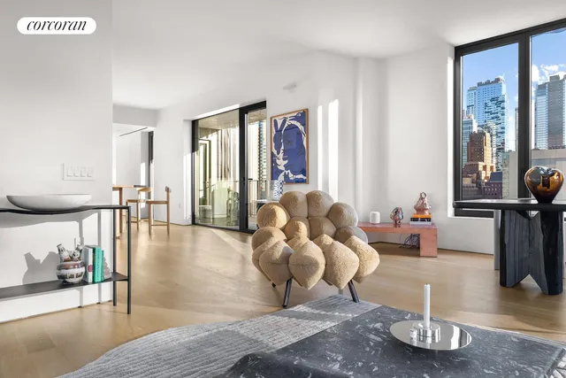 a living room with furniture and a rug