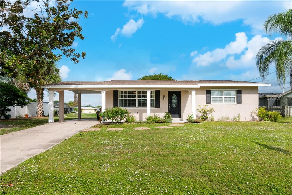 405 Clover Road Venice, FL 34293 - Photo 1 of 1 Front of home with large yard and front porch to enjoy the morning sun