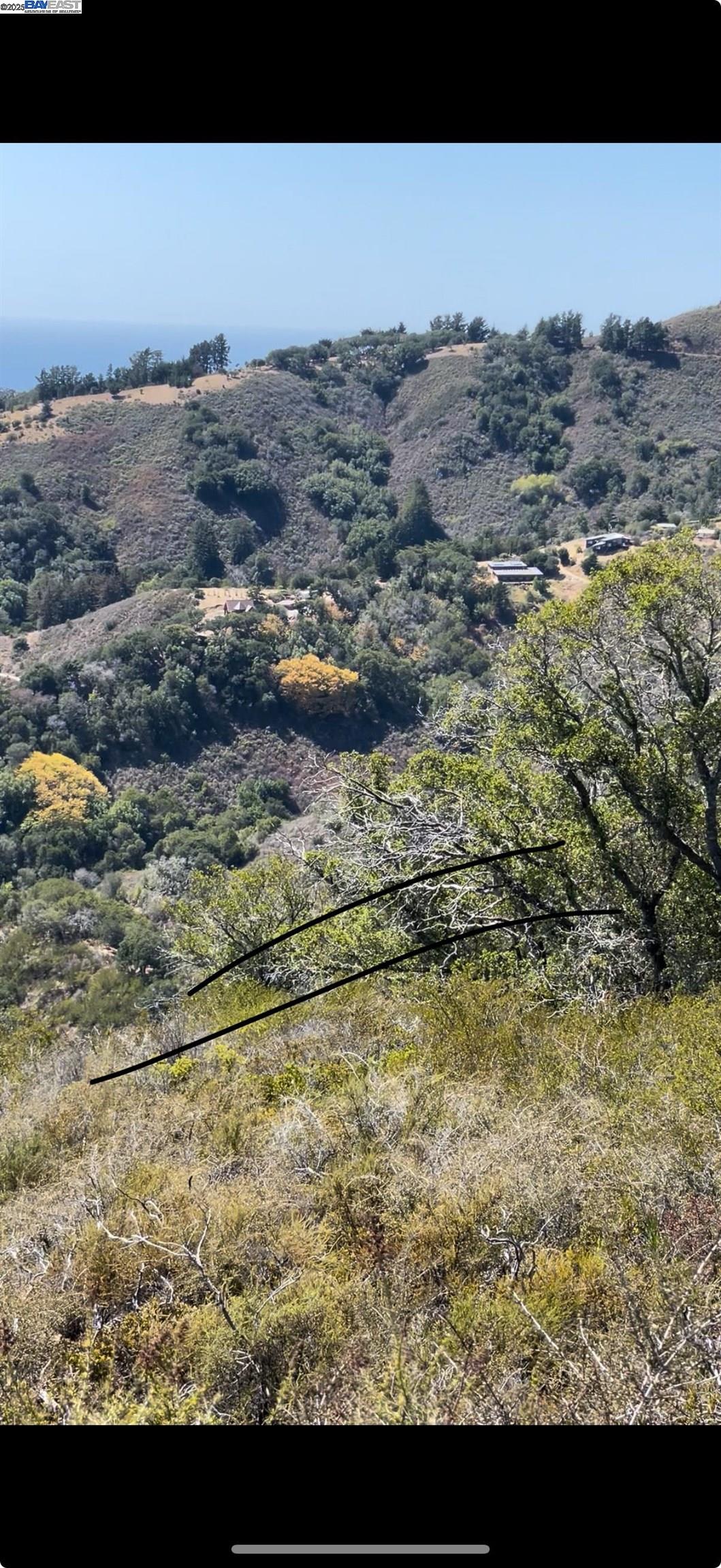 a view of ocean and mountain