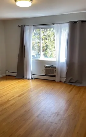 a view of room with window and a floor