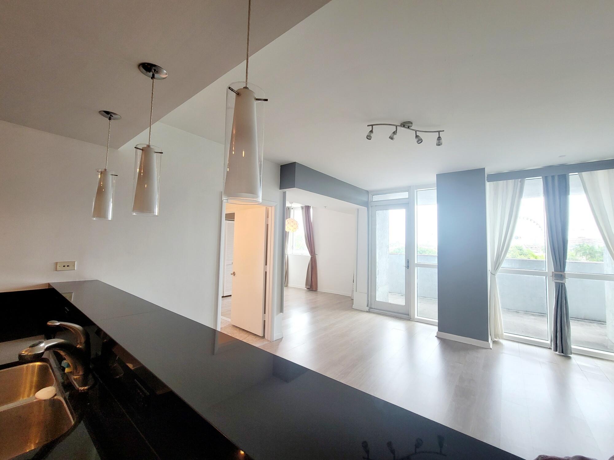 244 Biscayne Boulevard, Unit 401 Miami, FL 33132 - Photo 12 of 36 a view of a hallway with a large window