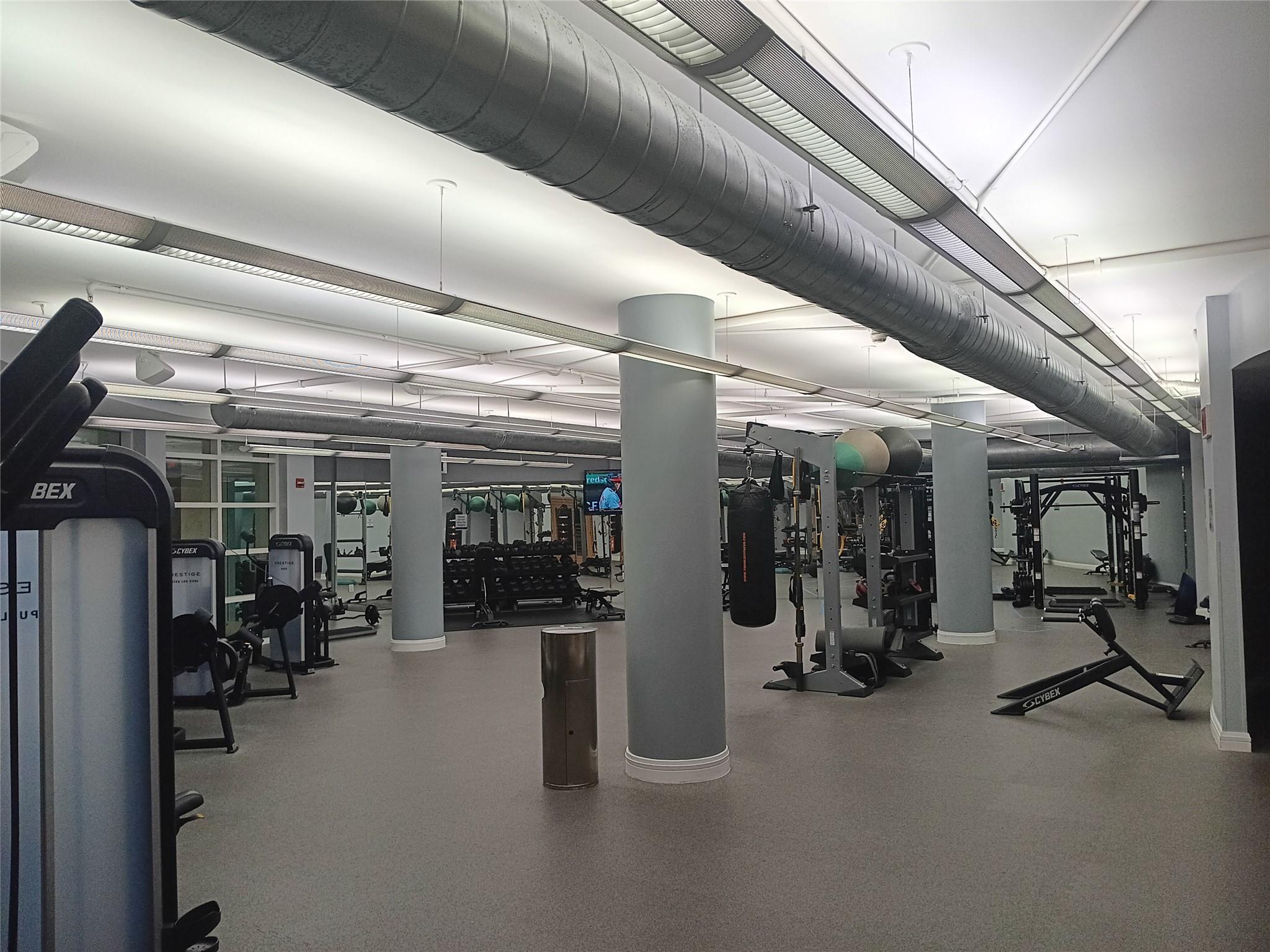 244 Biscayne Boulevard, Unit 401 Miami, FL 33132 - Photo 5 of 36 a view of a room with gym equipment