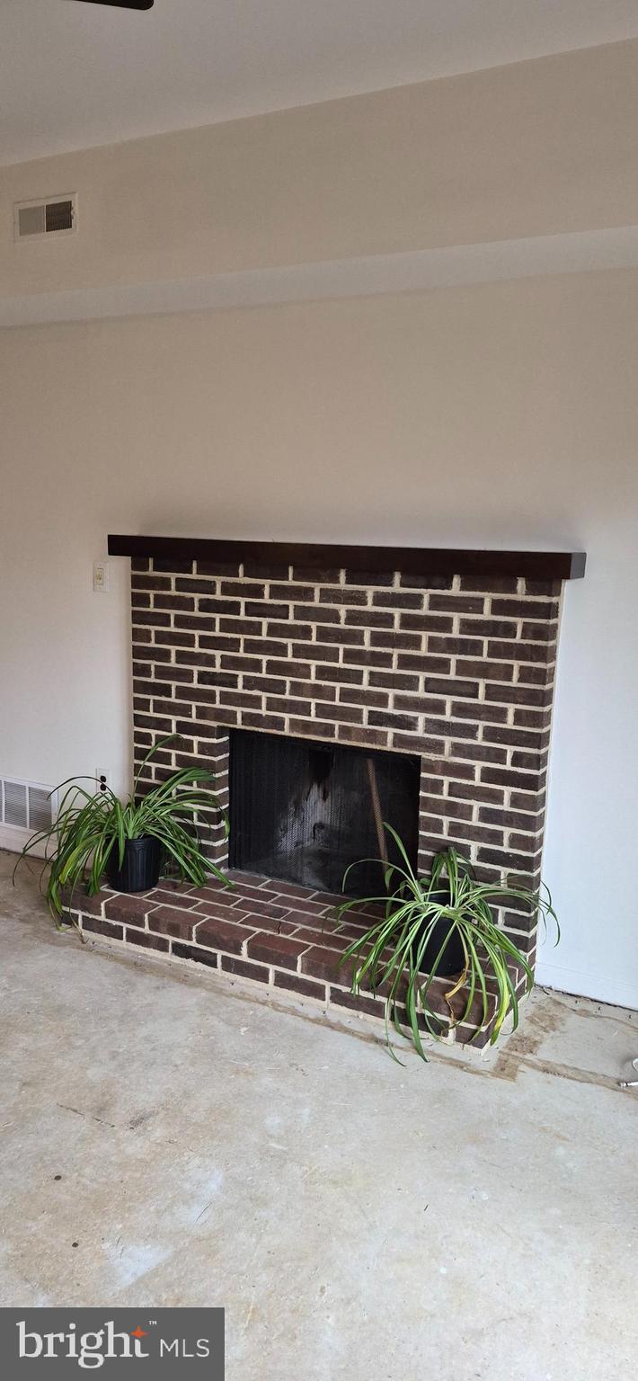 8 Del Sol Place Sicklerville, NJ 08081 - Photo 6 of 40 a backyard of a house with potted plants and large parking space