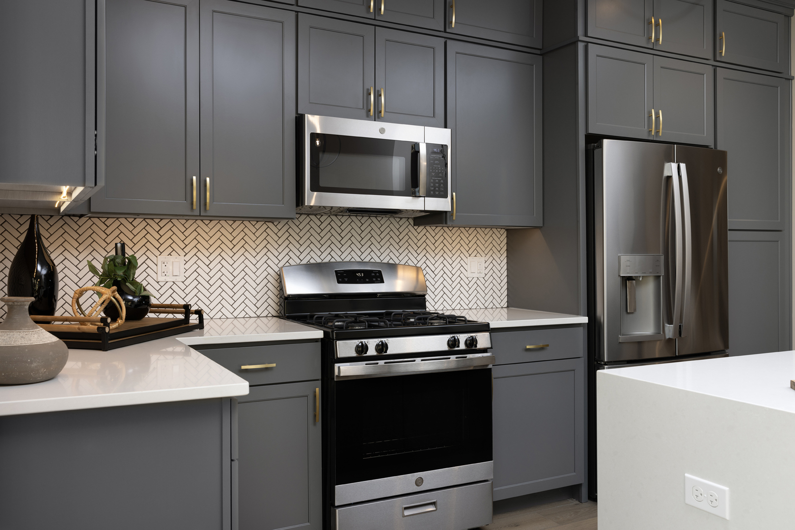 342 Timberleaf Circle Roselle, IL 60172 - Photo 5 of 8 a kitchen with stainless steel appliances a sink a stove a microwave a refrigerator and cabinets