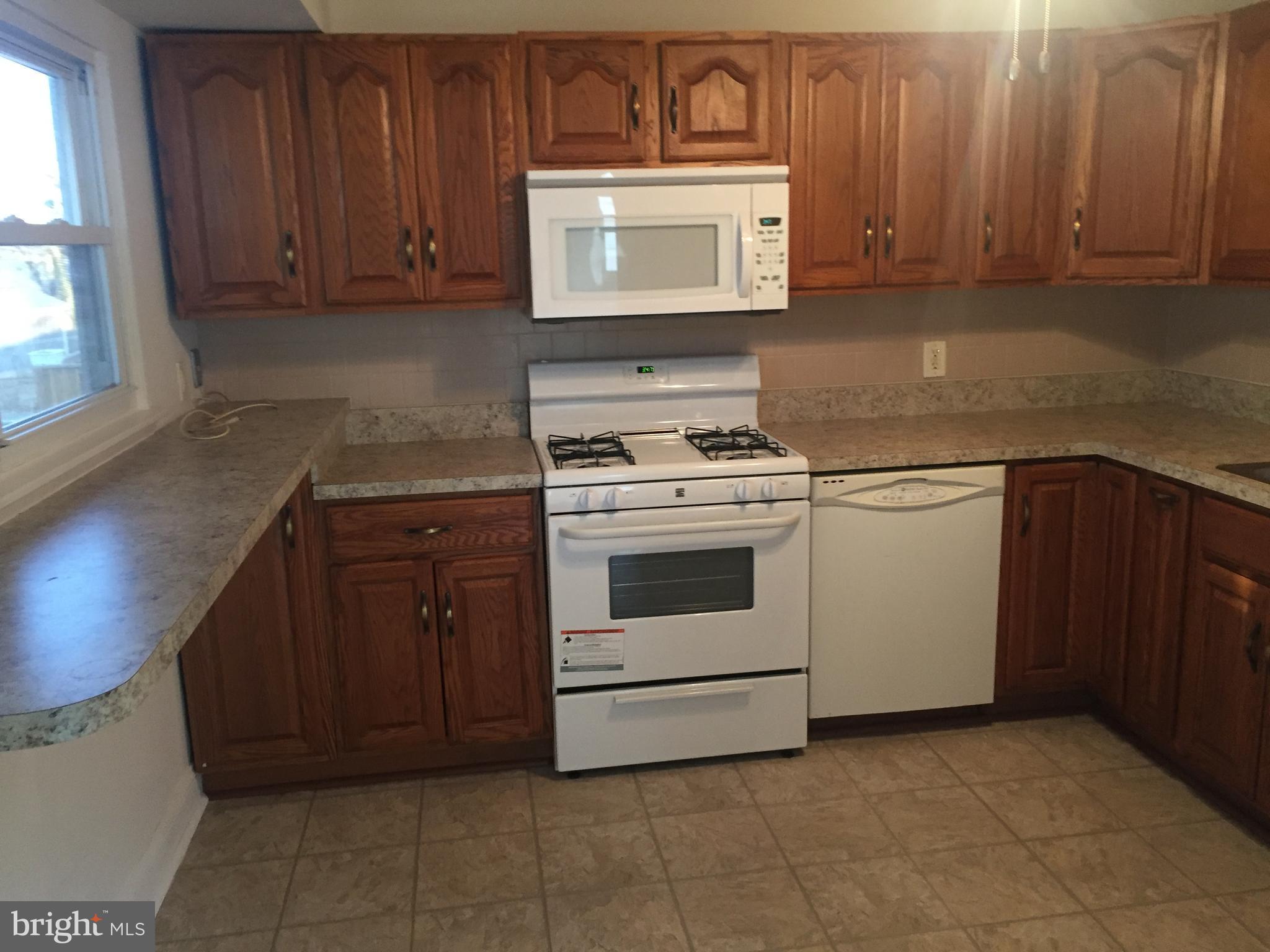 238 Candytuft Road Reisterstown, MD 21136 - Photo 5 of 18 Kitchen WITH NEW APPLIANCES AND BREAKFAST BAR